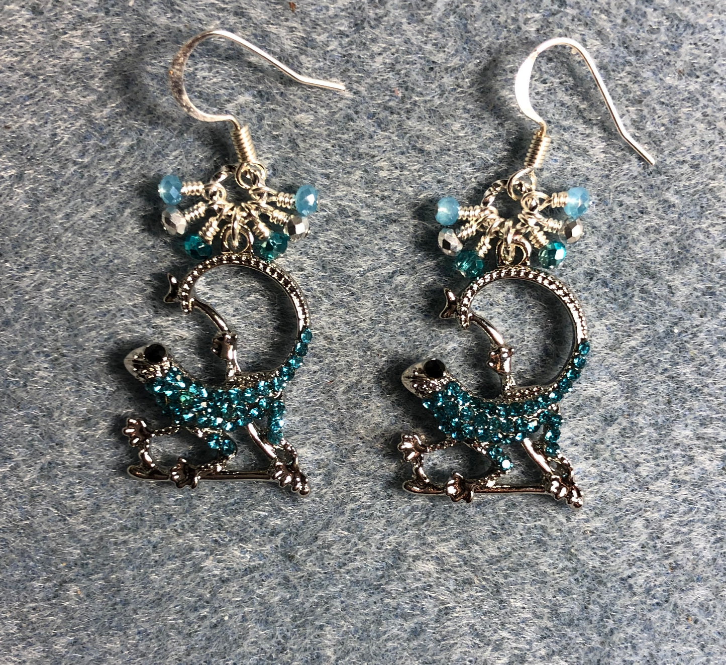 Silver and turquoise rhinestone lizard charm earrings adorned with small dangling turquoise and silver Chinese crystal beads.