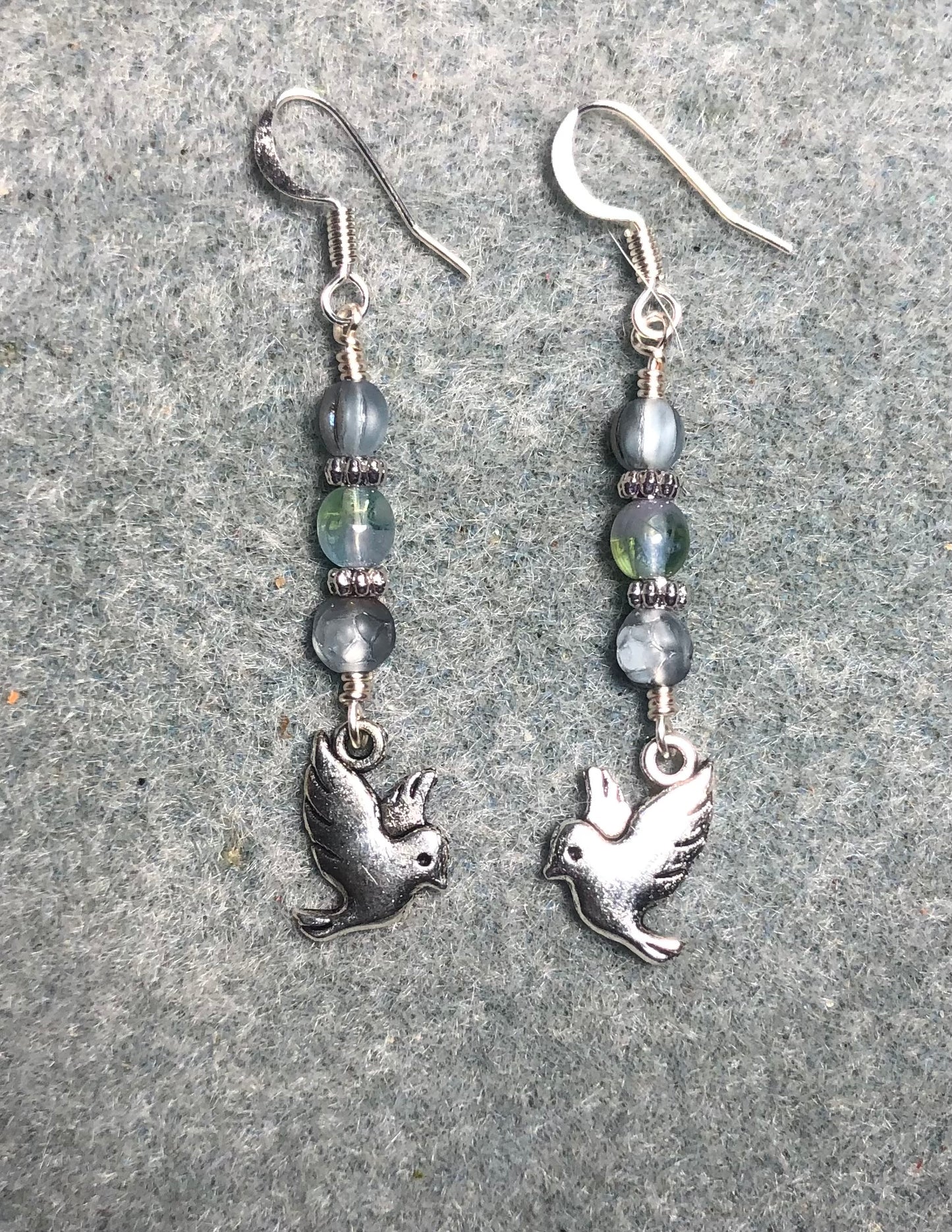 Silver dove charm earrings adorned with small light blue Czech glass beads