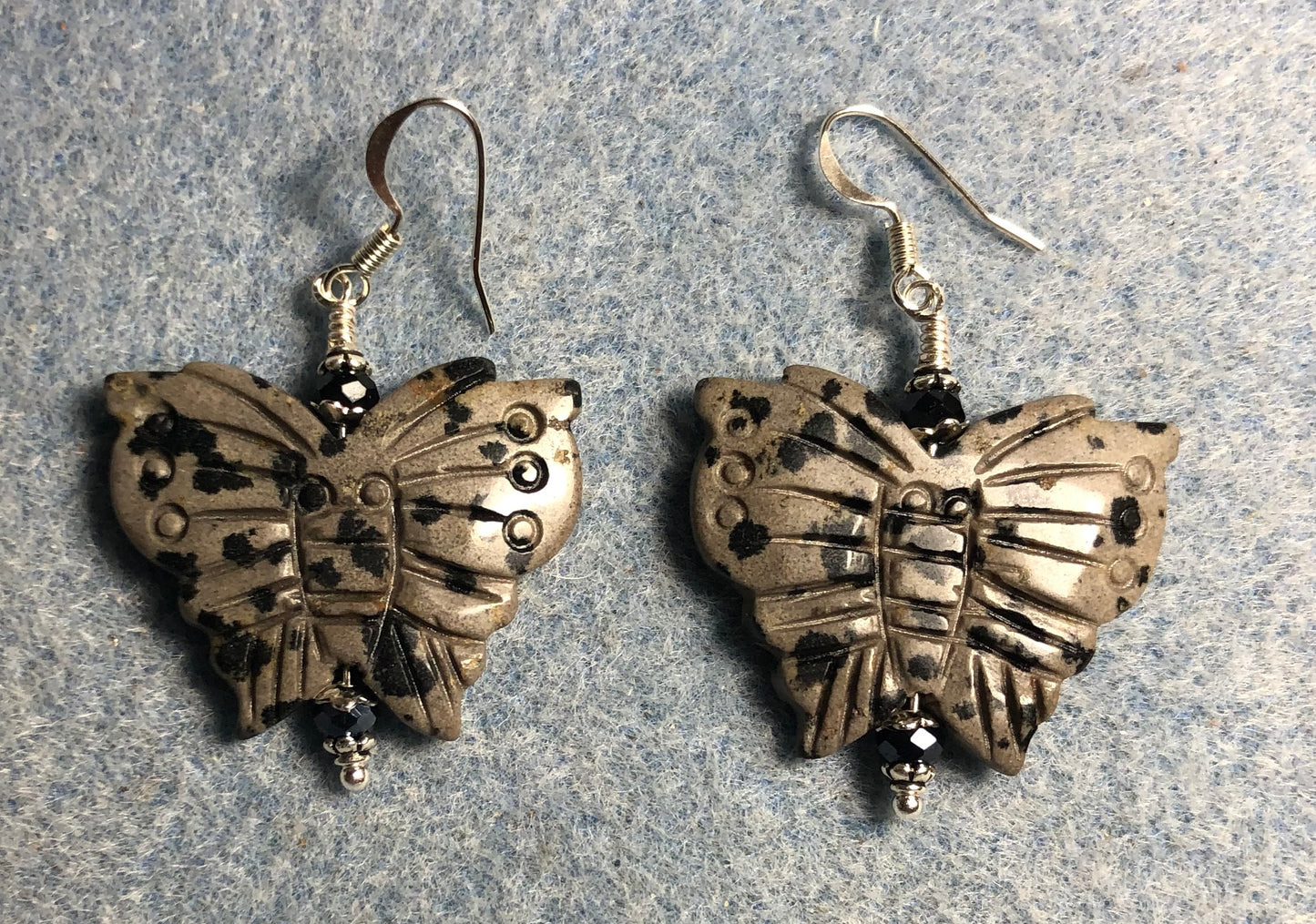 Large dalmatian jasper gemstone butterfly bead earrings with black Chinese crystal beads.
