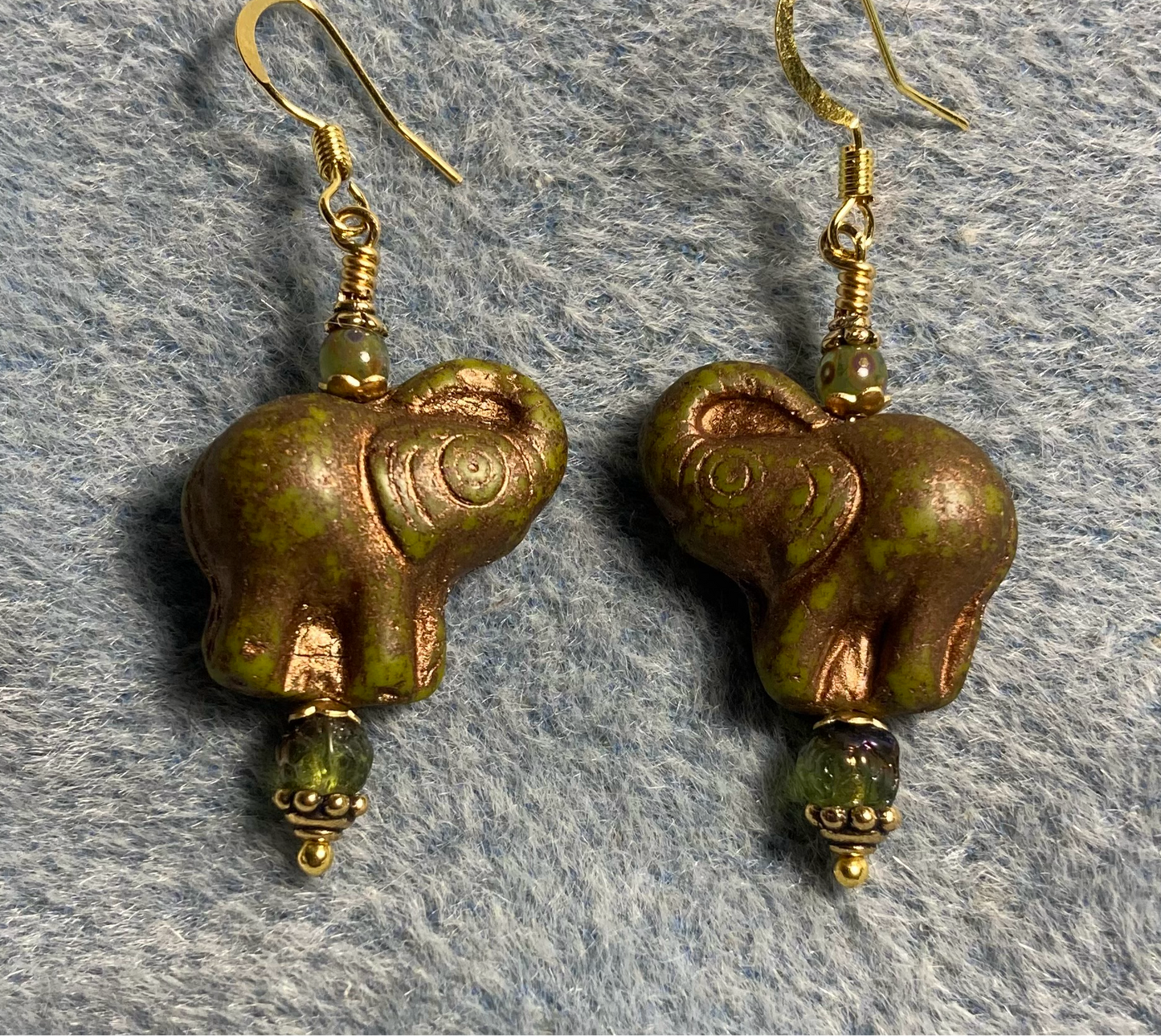 Olive green (with copper inlay) Czech glass elephant bead earrings adorned with olive green Czech glass beads.