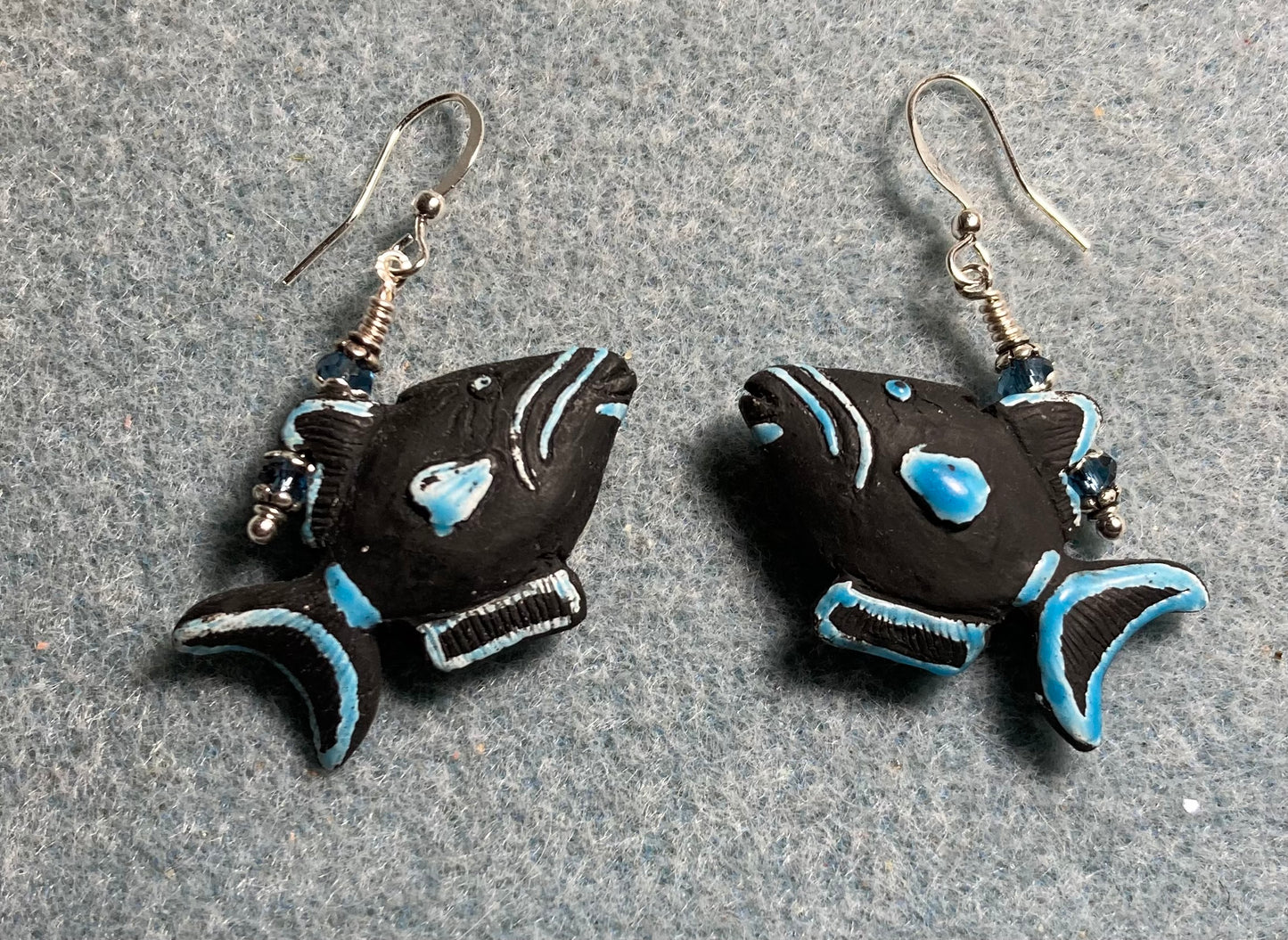 Black and blue ceramic triggerfish bead earrings adorned with blue Chinese crystal beads.