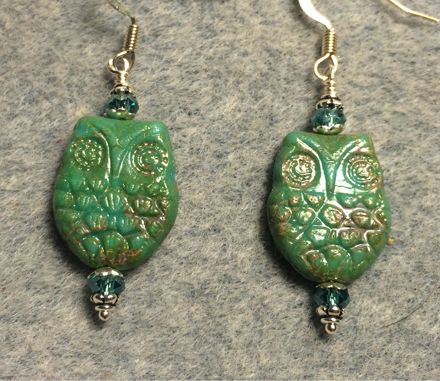 Green (with light Picasso wash) Czech glass owl bead earrings adorned with aqua green Chinese crystal beads.