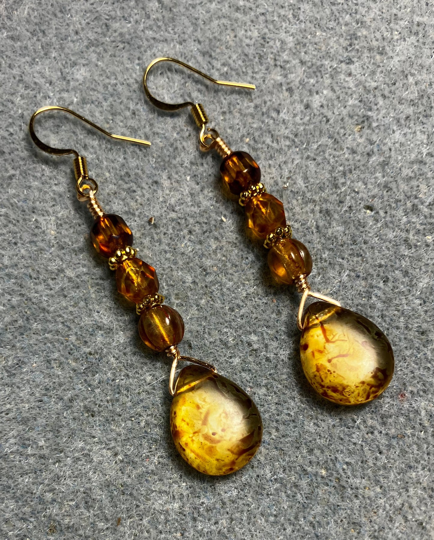 Amber brown Czech glass pear drop bead earrings adorned with amber Czech glass beads.