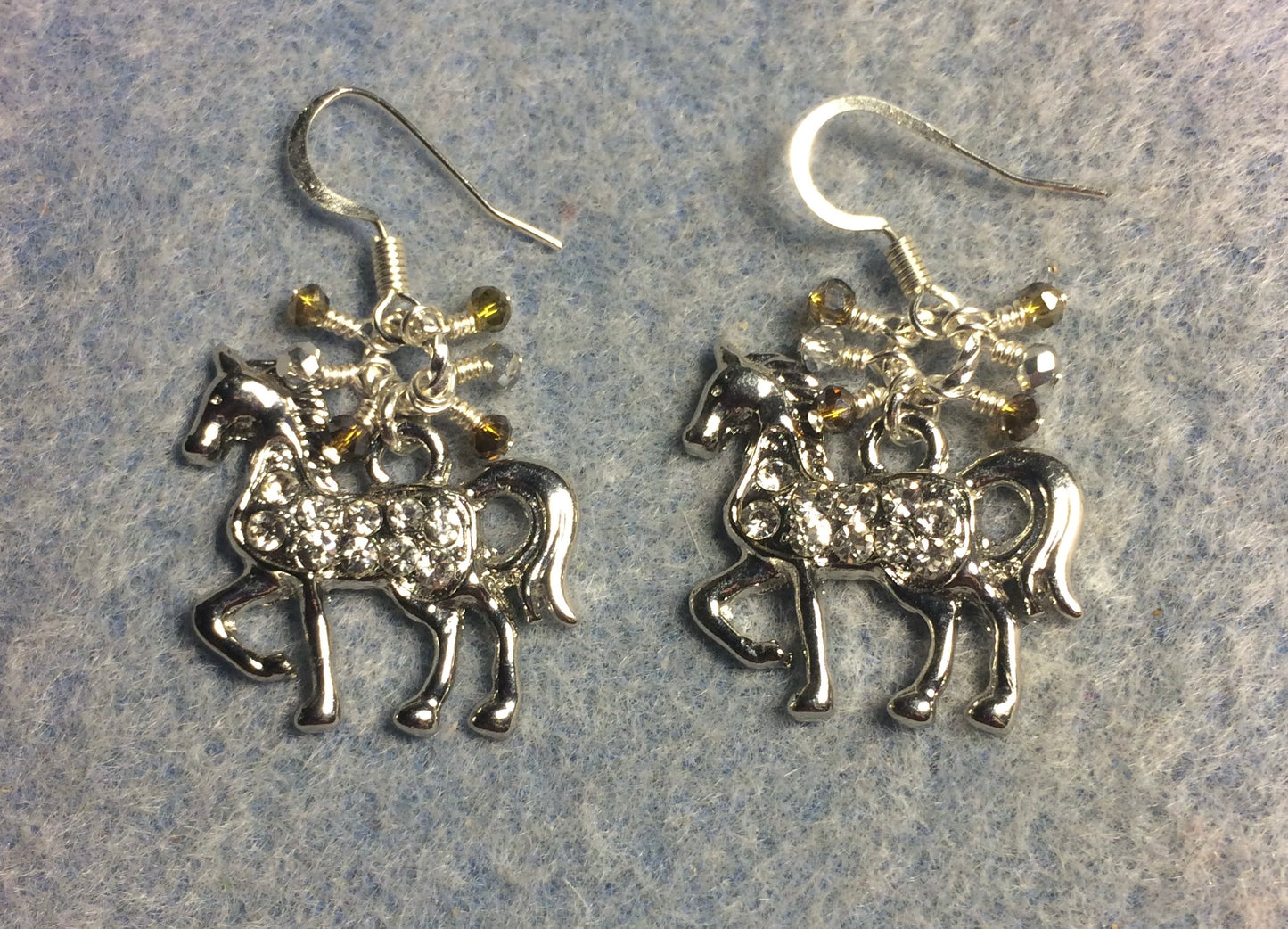 Silver and clear rhinestone horse charm earrings adorned with small dangling silver and gray Chinese crystal beads.