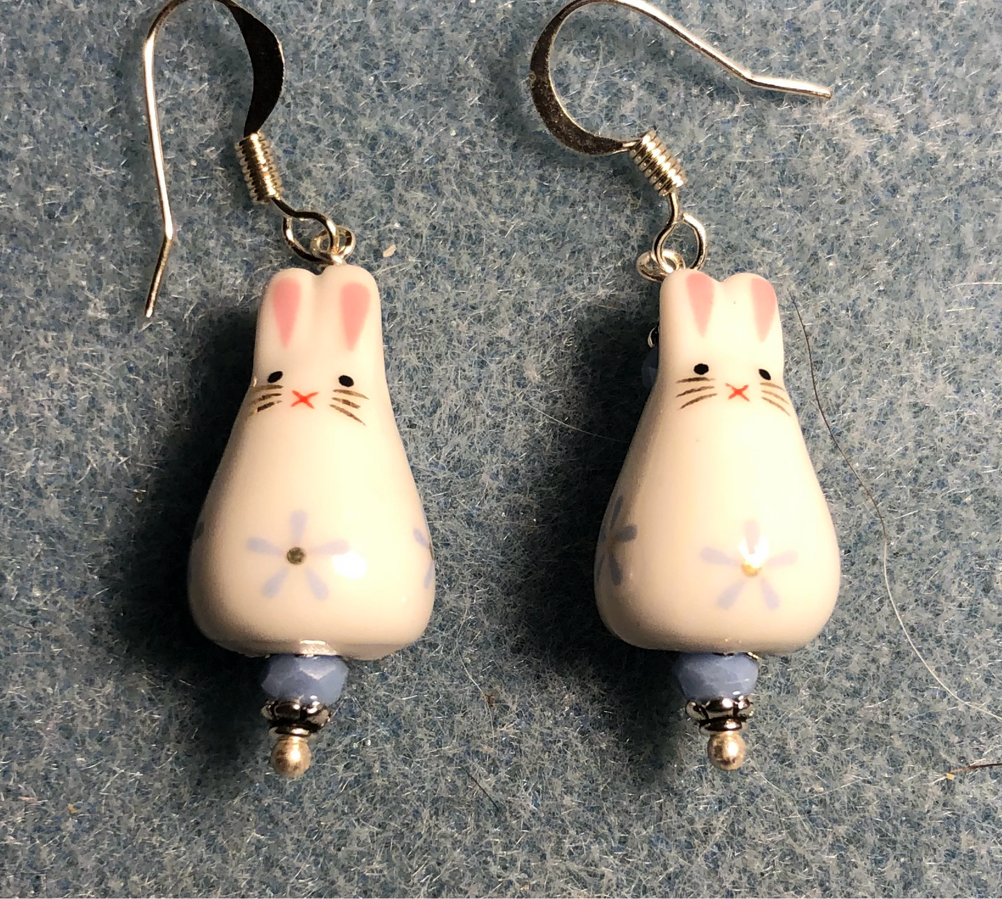 Small light blue and white ceramic bunny rabbit bead earrings adorned with light blue Chinese crystal beads.