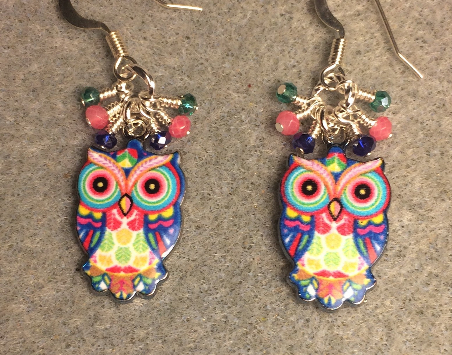 Pink, dark blue, and teal enamel owl charm earrings adorned with tiny dangling pink, dark blue, and teal Chinese crystal beads.