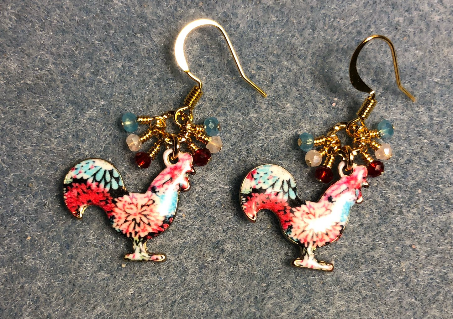 Red, turquoise, and white enamel rooster charm earrings adorned with tiny dangling red, turquoise, and white Chinese crystal beads.