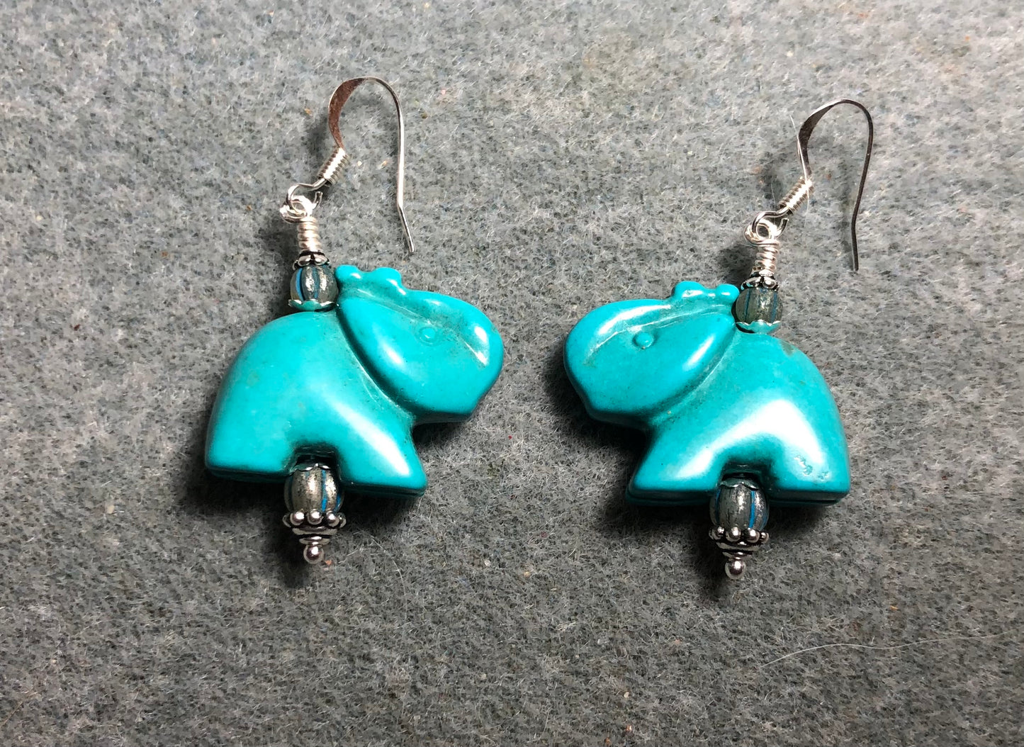 Turquoise howlite gemstone elephant bead earrings adorned with turquoise Chinese crystal beads.