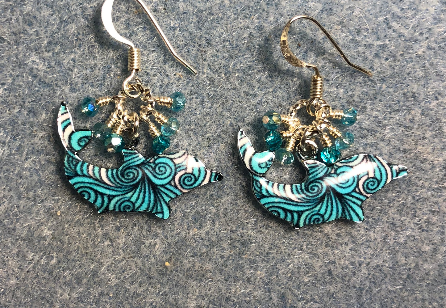 Turquoise patterned enamel shark charm earrings adorned with tiny dangling turquoise and silver Chinese crystal beads.