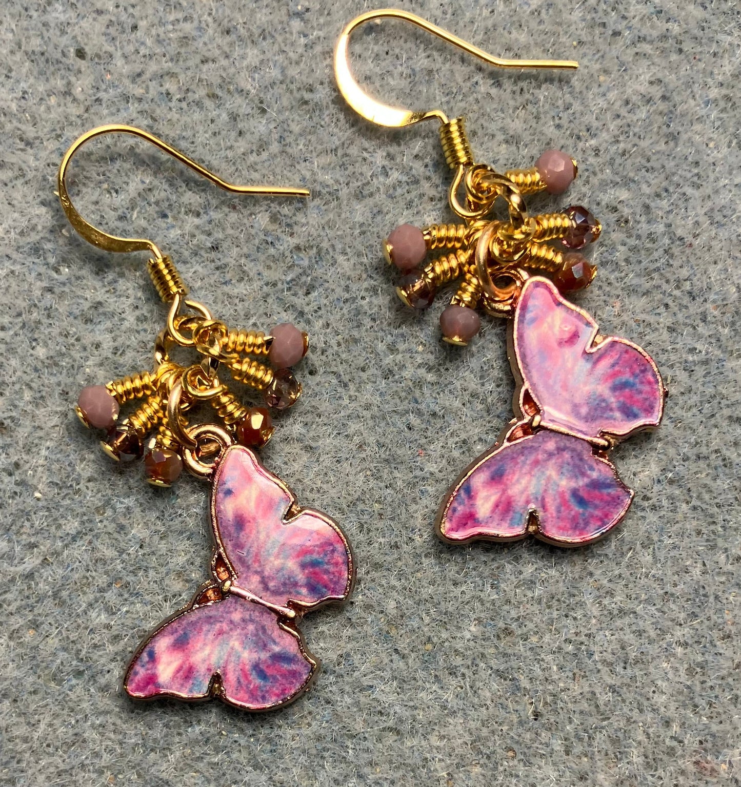 Lavender enamel butterfly charm earrings adorned with tiny dangling lavender Chinese crystal beads.
