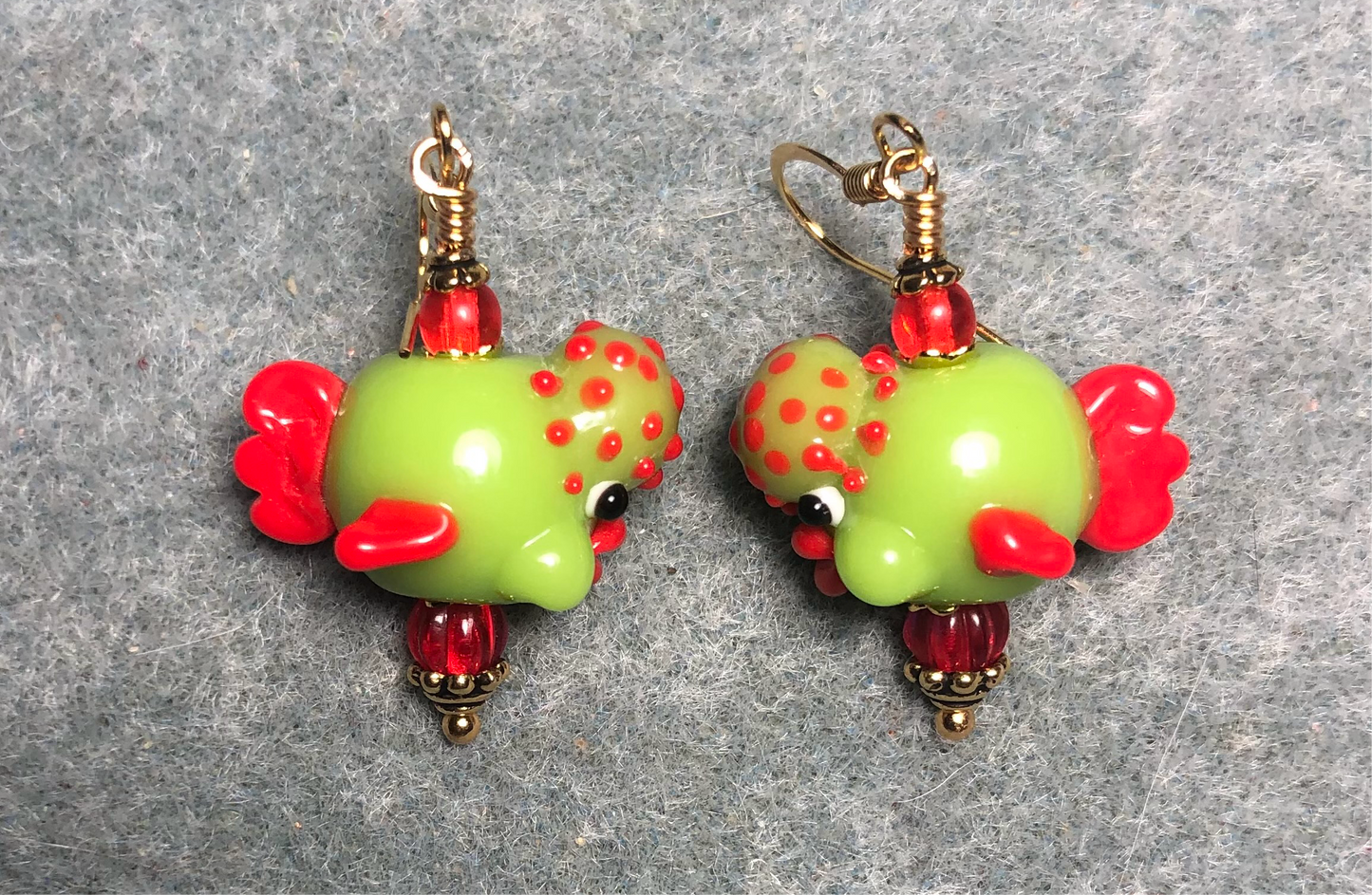 Lime green and red lamp work clownfish bead earrings adorned with red Czech glass beads.