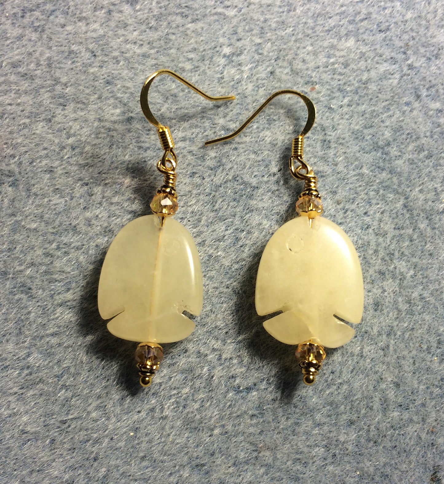 Golden quartz gemstone fish bead earrings adorned with topaz Chinese crystal beads.