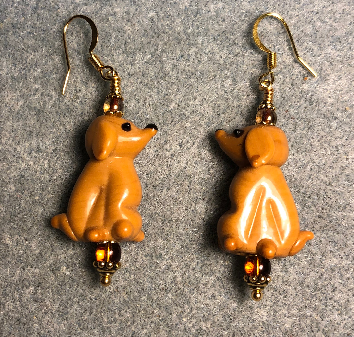 Caramel lamp work puppy dog bead earrings adorned with caramel Czech glass beads.