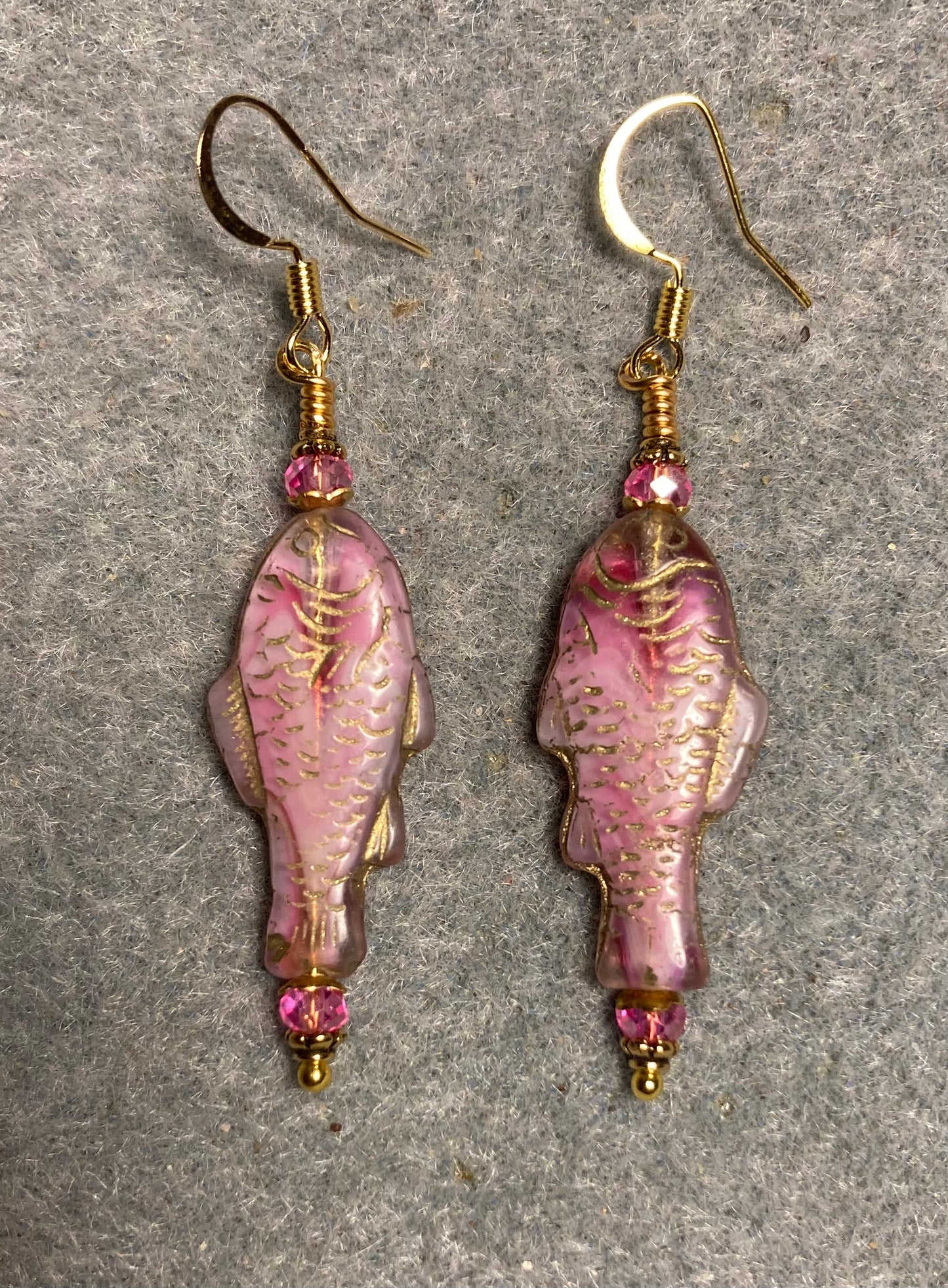 Hot pink (with gold inlay) Czech glass fish bead earrings adorned with hot pink Chinese crystal beads.