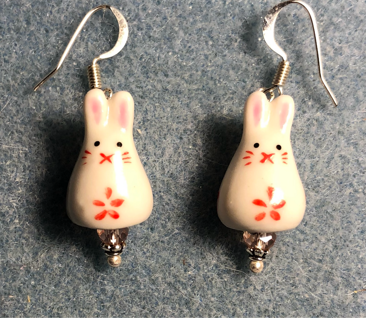 Small pink and white ceramic bunny rabbit bead earrings adorned with pink Chinese crystal beads.