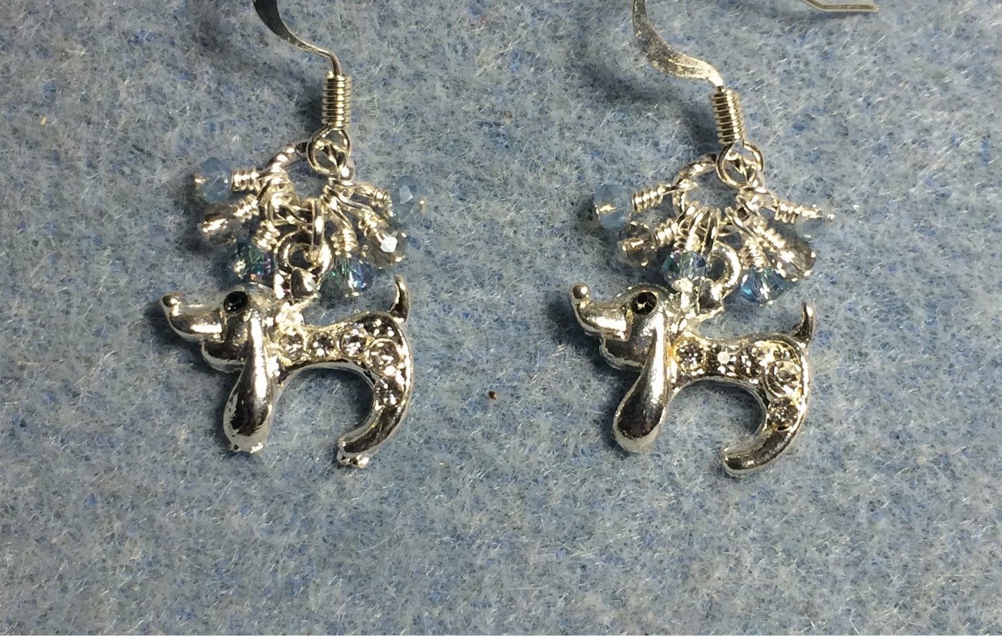 Tiny silver and clear rhinestone dachshund charm earrings adorned with tiny dangling light blue and clear Chinese crystal beads.