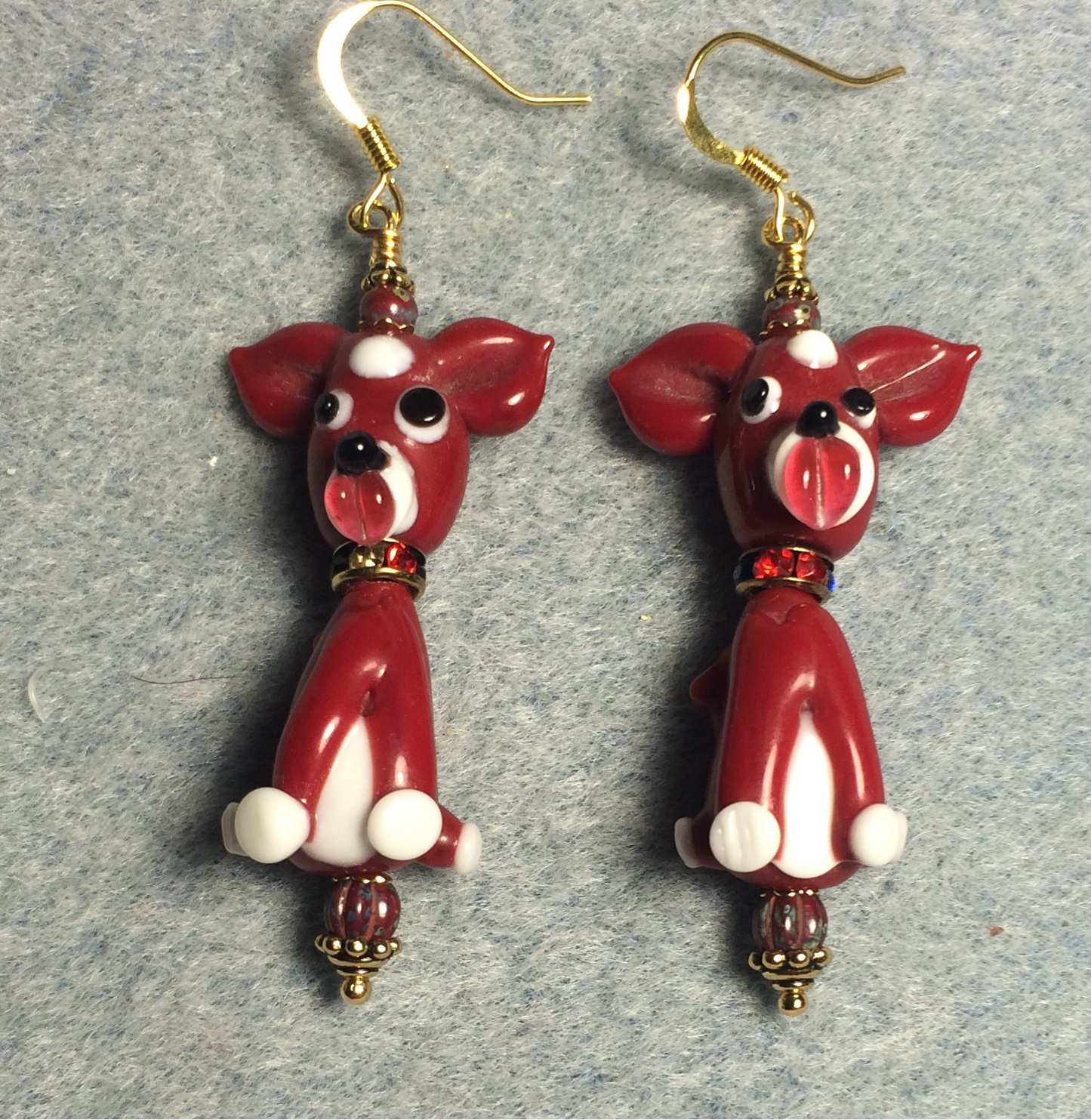 Dark red lamp work dog bead earrings adorned with dark red rhinestone rondelle “collars” and dark red Picasso Czech glass beads.