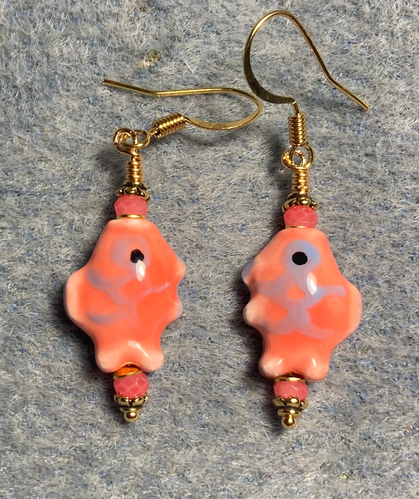 Small salmon and blue ceramic fish bead earrings adorned with salmon Chinese crystal beads.