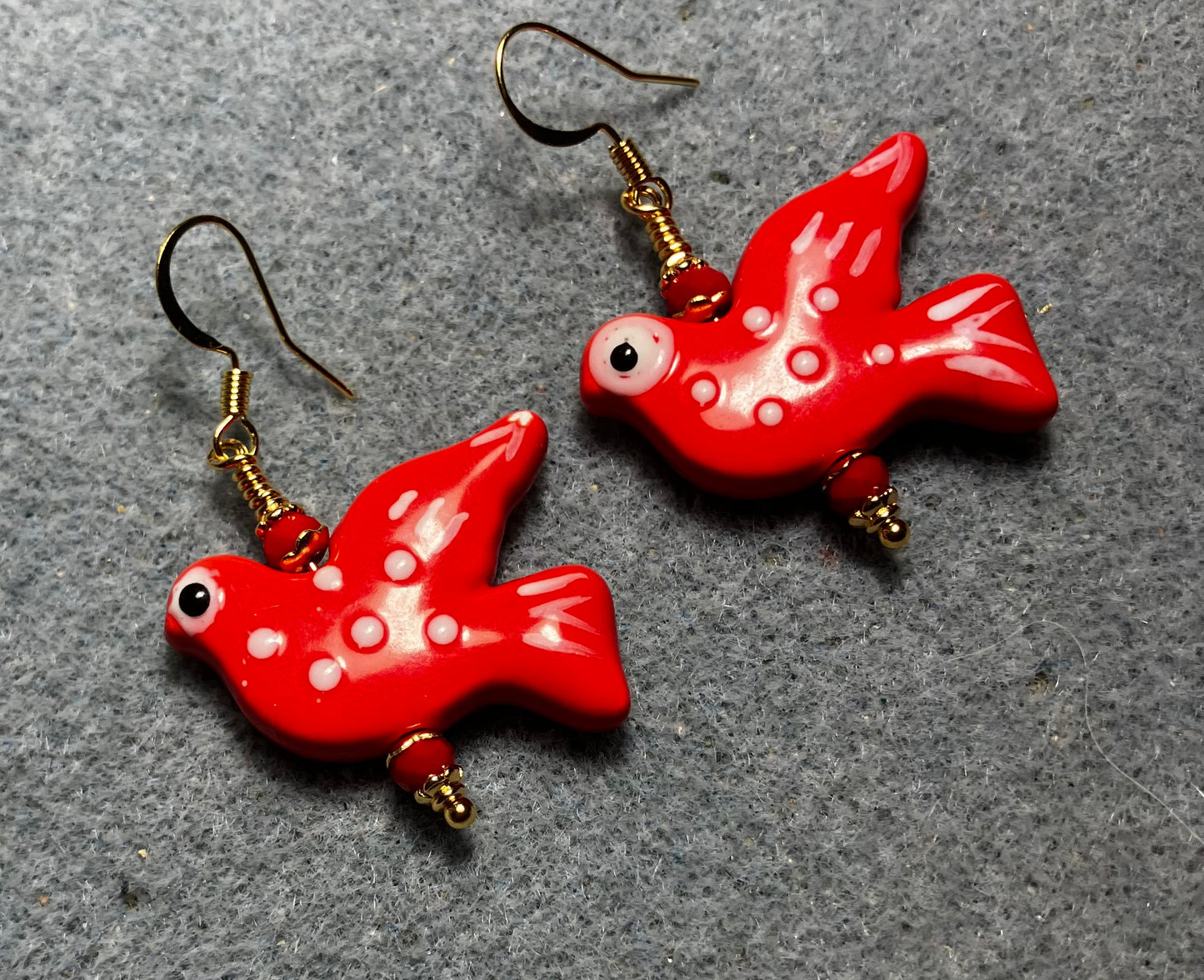 Large red ceramic flying dove bead earrings adorned with red Chinese crystal beads.