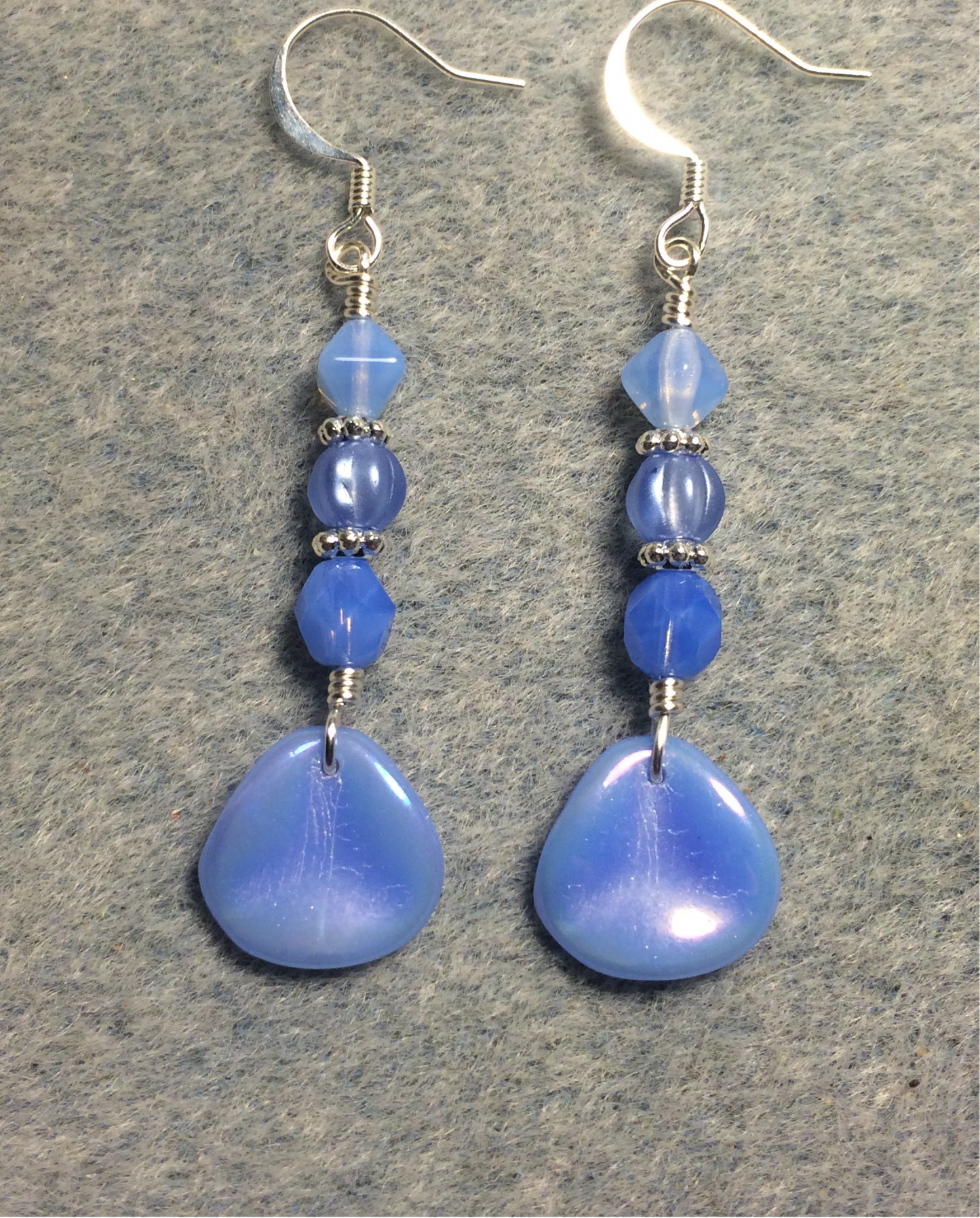 Opaque cornflower blue Czech glass rose petal earrings adorned with light blue Czech glass beads.
