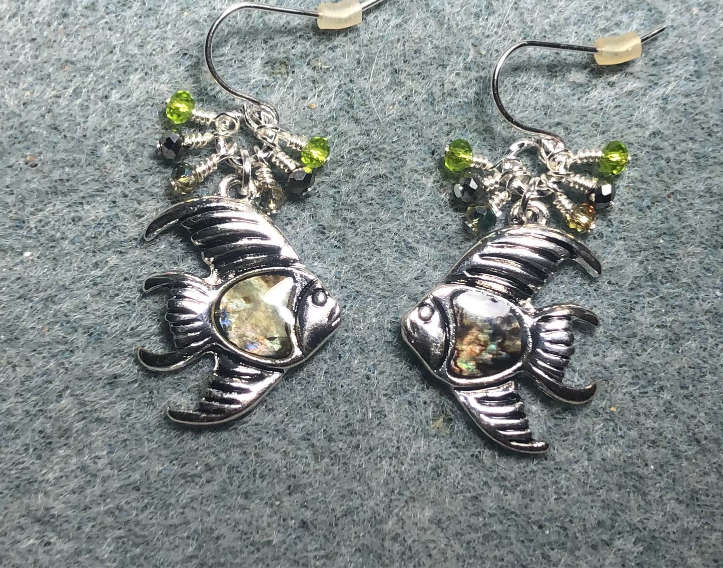 Silver and abalone goldfish charm earrings adorned with small dangling green and silver Chinese crystal beads.