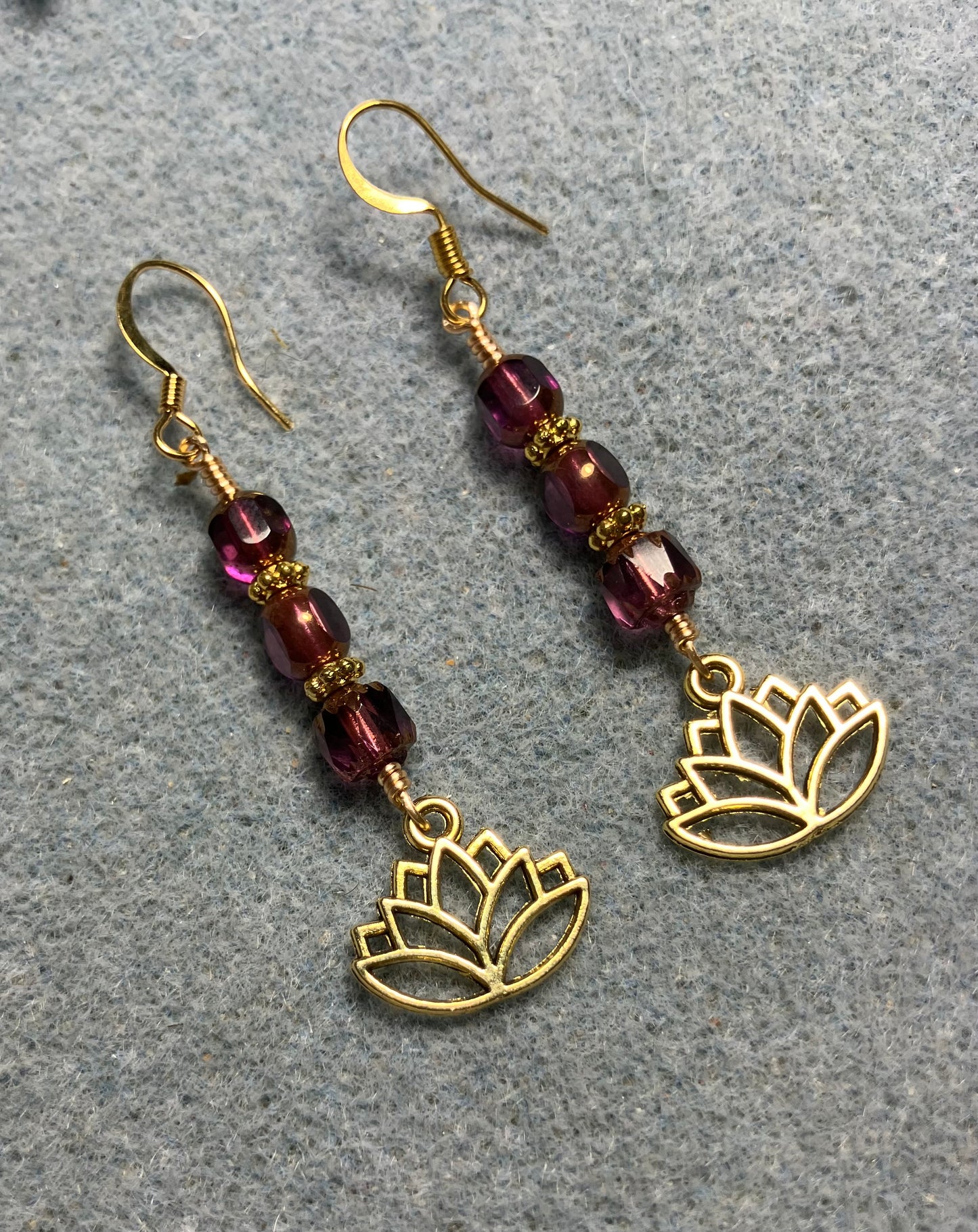 Gold lotus flower charm earrings adorned with purple violet Czech glass beads