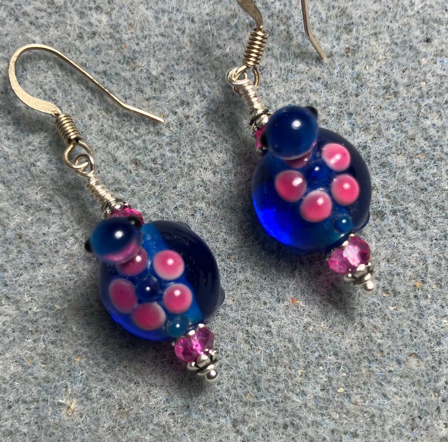 Bright blue and hot pink lamp work turtle bead earrings adorned with hot pink Chinese crystal beads.