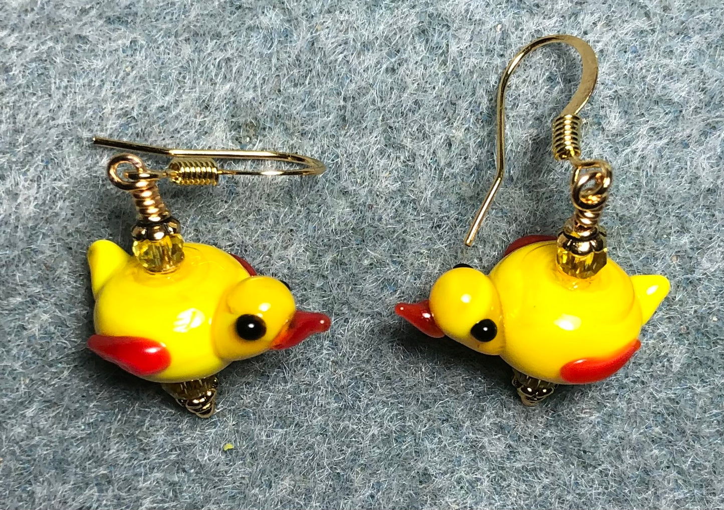 Small yellow lamp work chick bead earrings adorned with yellow Chinese crystal beads.