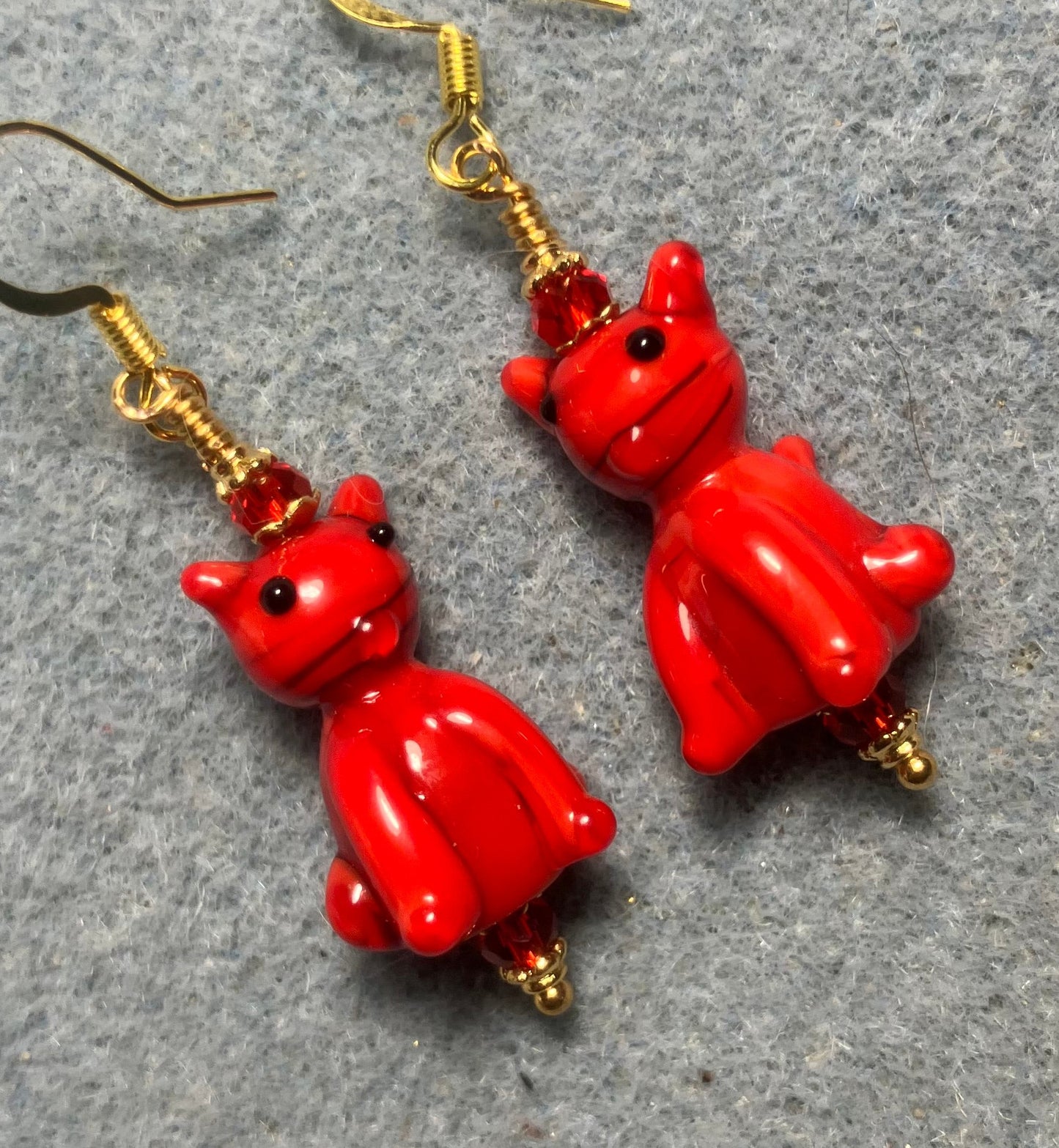 Opaque red lamp cat bead earrings adorned with red Chinese crystal beads.
