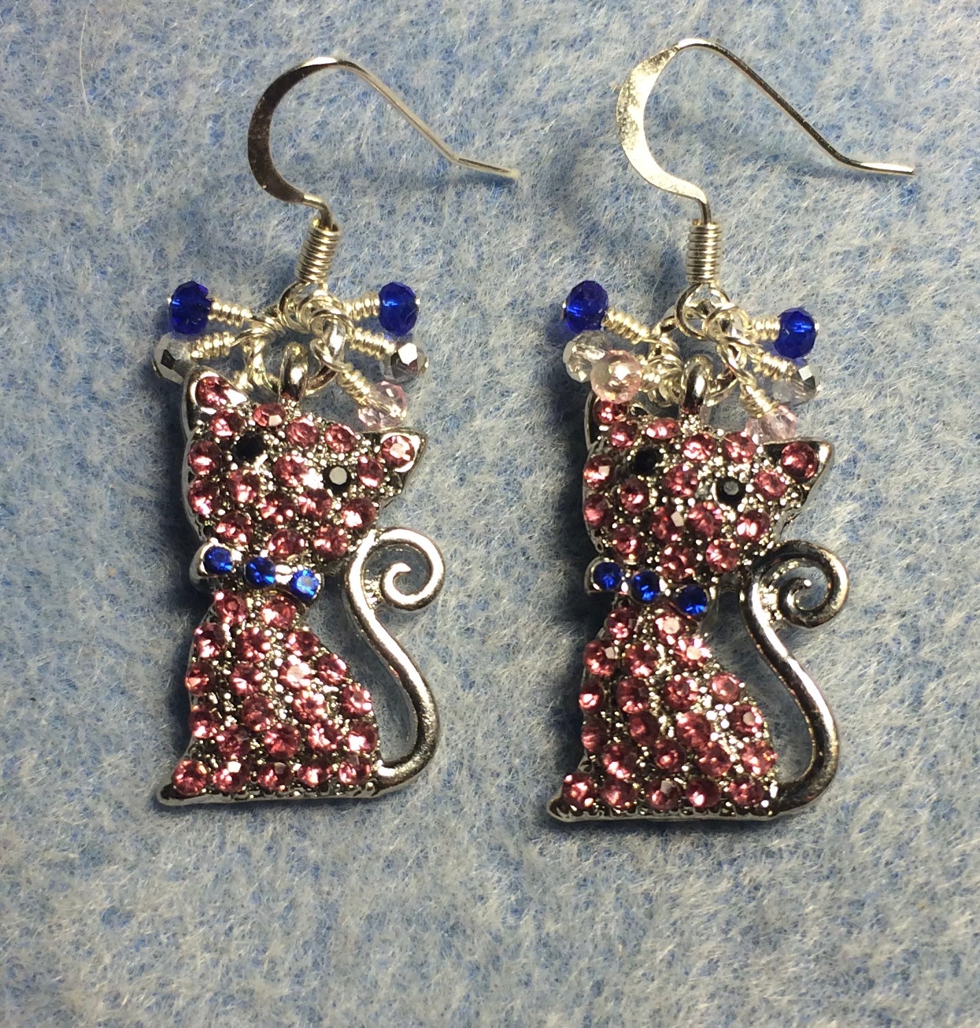 Pink and blue rhinestone cat charm earrings adorned with small dangling silver, pink, and blue Chinese crystal beads.