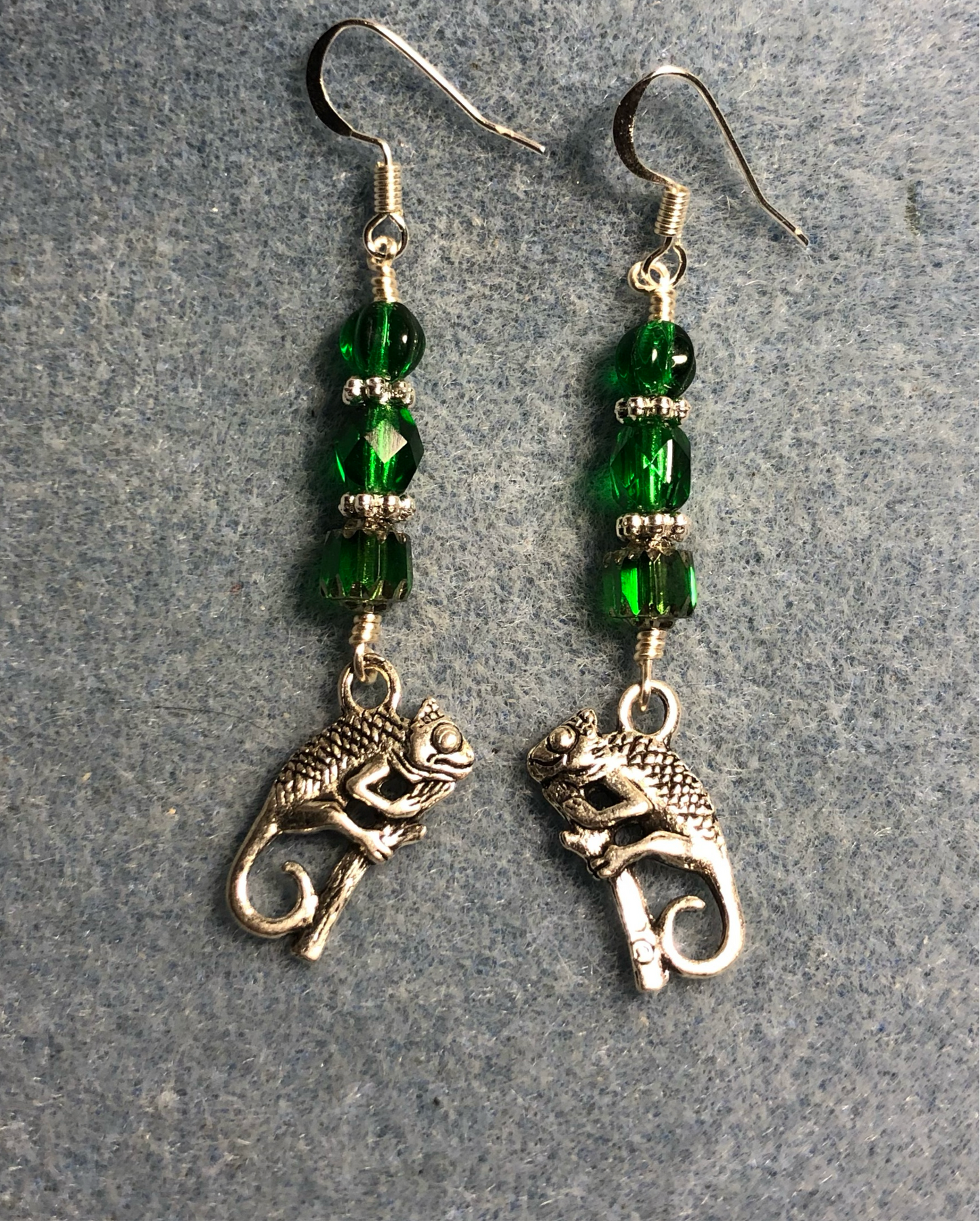 Silver chameleon charm earrings adorned with emerald green Czech glass beads