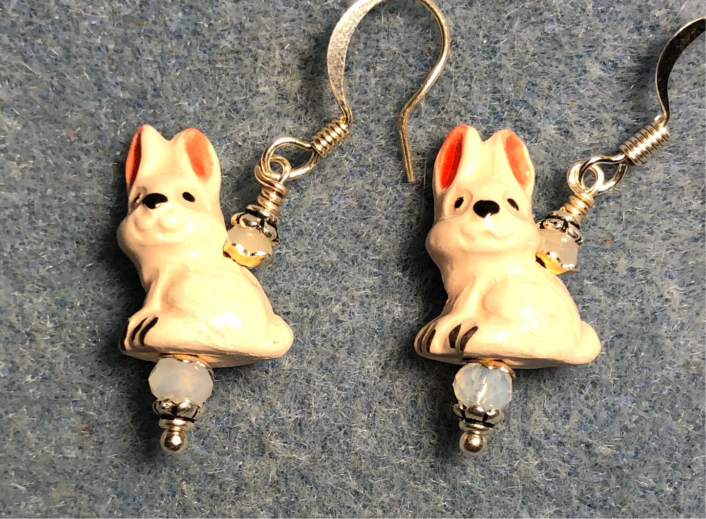 Small white and pink ceramic rabbit bead earrings adorned with white Chinese crystal beads.