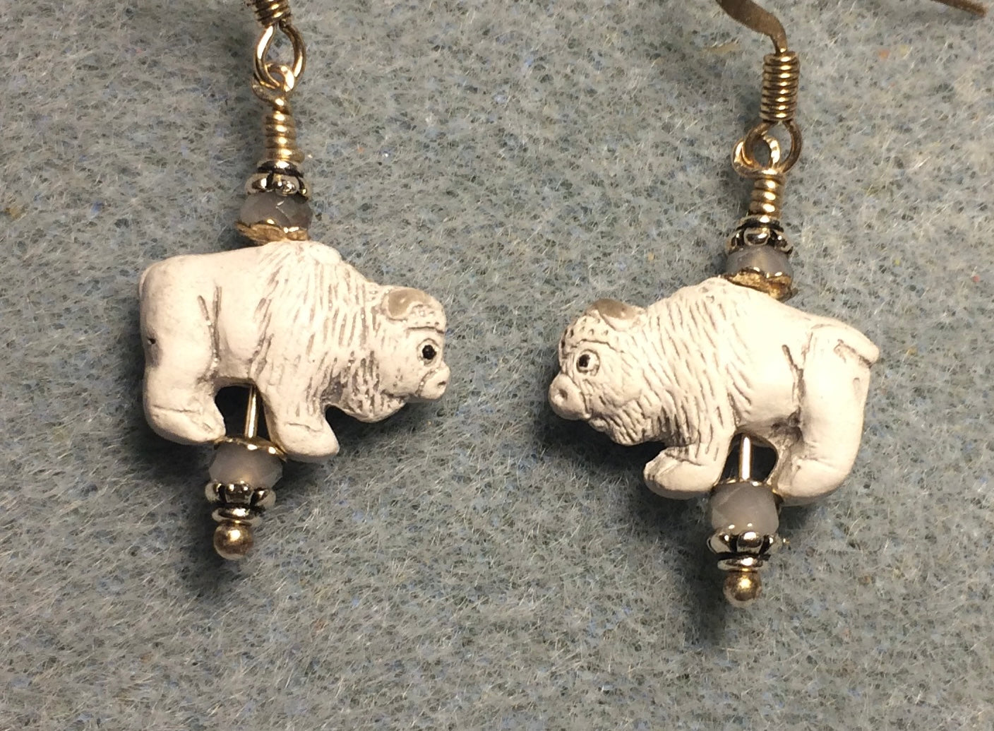 Small white ceramic buffalo bead earrings adorned with small white Chinese crystal beads.