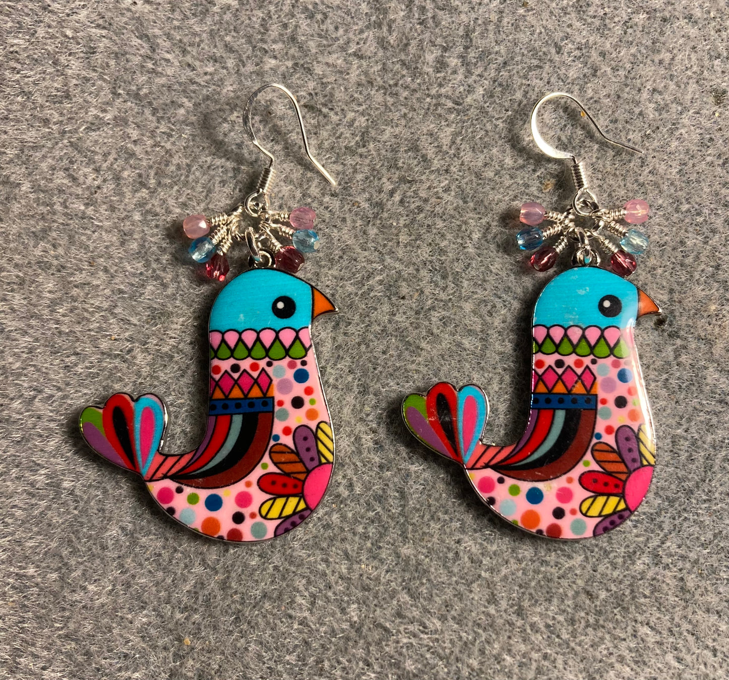 Large pink, red, and turquoise enamel chicken charm earrings adorned with tiny dangling pink, red, and turquoise Czech glass beads.