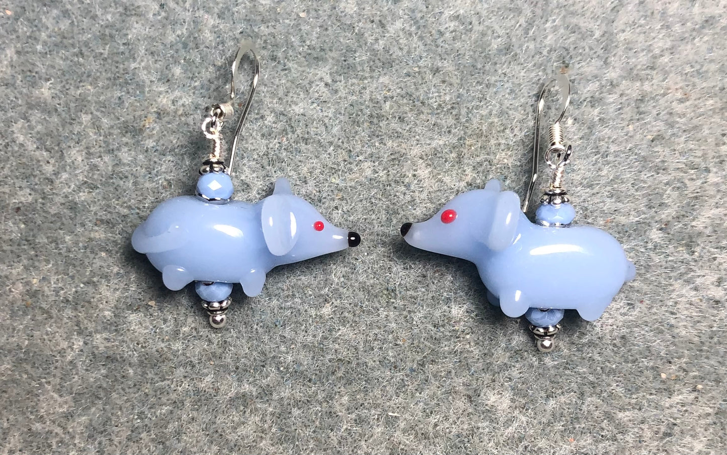 Light blue lamp work mouse bead earrings adorned with light blue Chinese crystal beads.