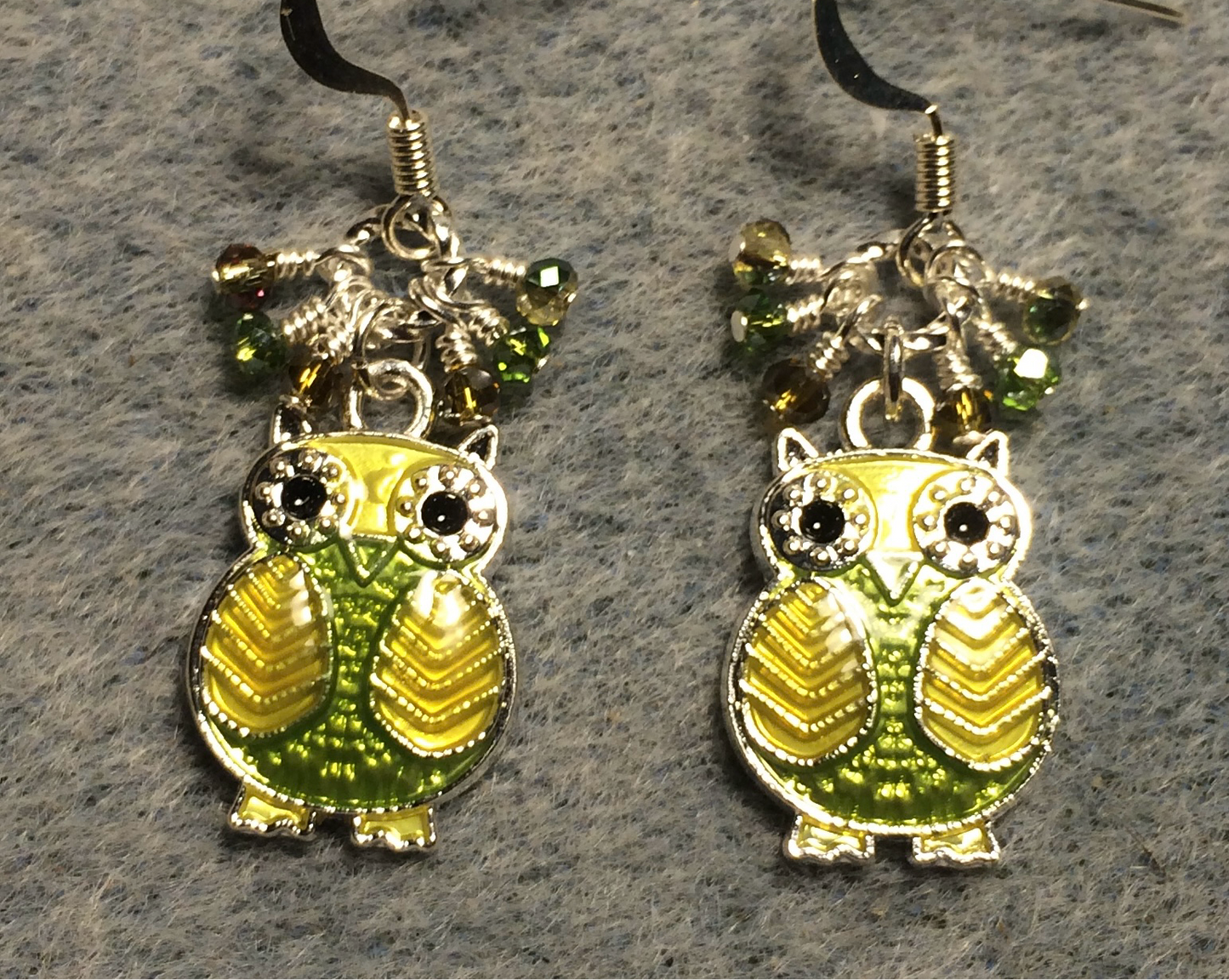 Olive green and light green enamel owl charm earrings adorned with tiny dangling olive green and light green Chinese crystal beads.