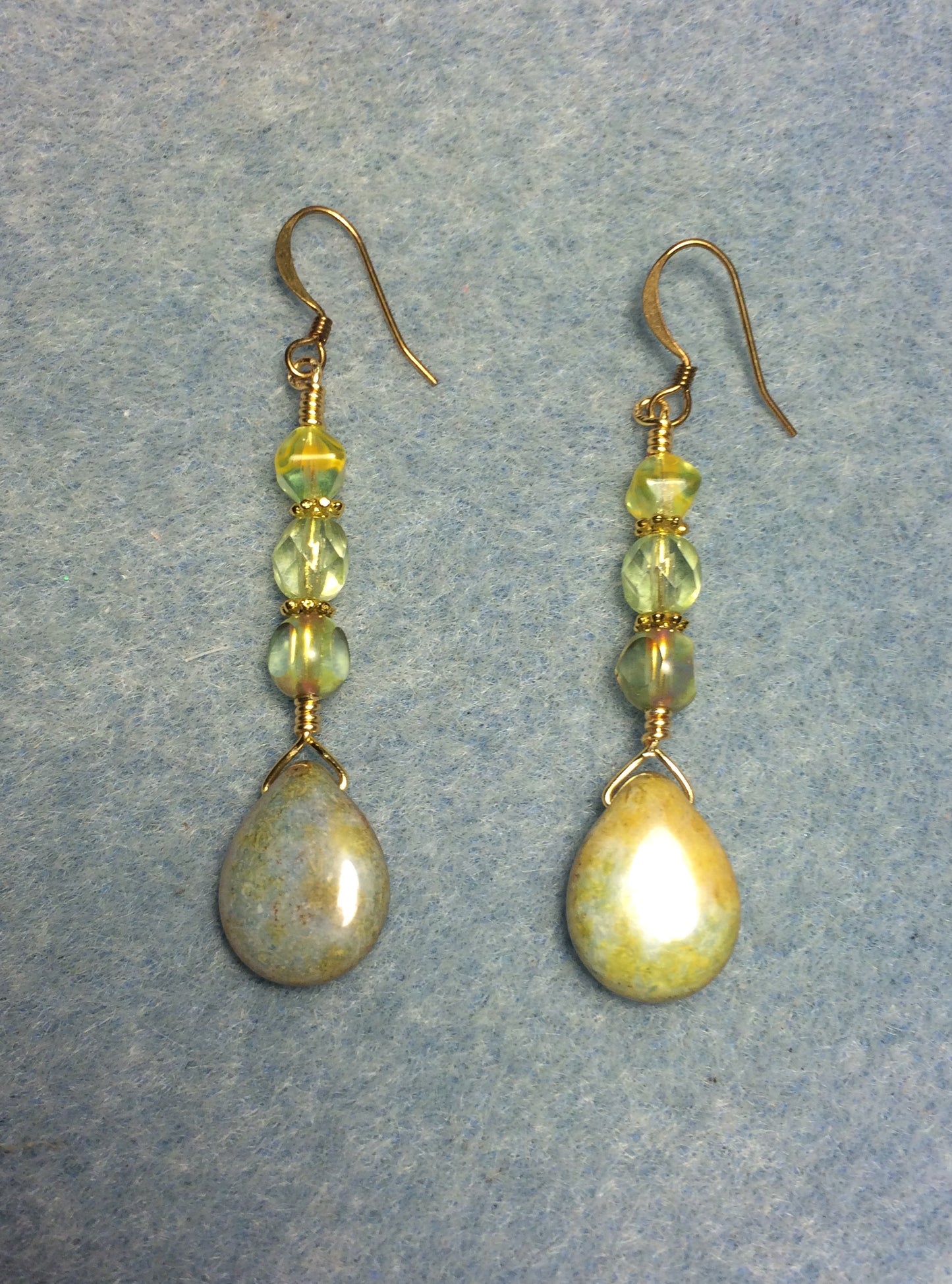 Yellow green Czech glass pear drop bead earrings adorned with yellow green Czech glass beads.