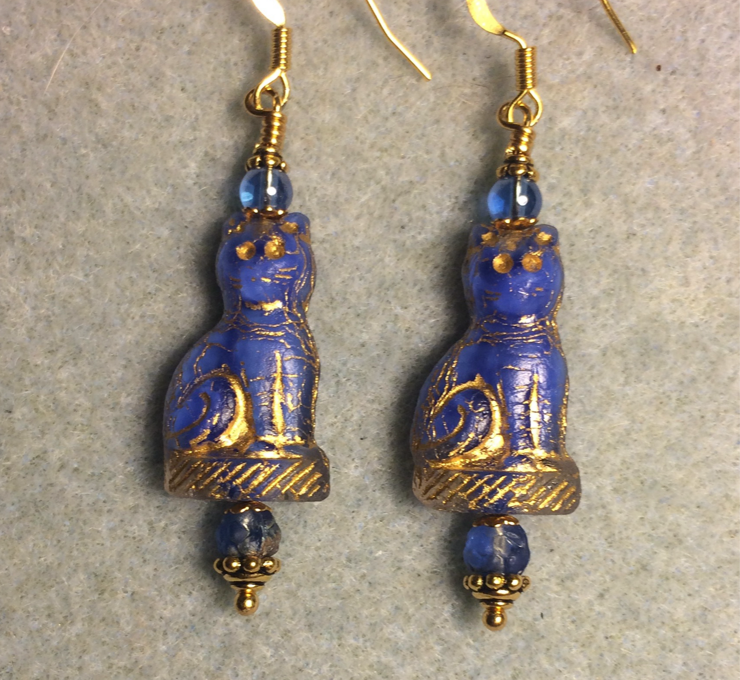 Royal blue (with gold inlay) fancy Czech glass cat bead earrings adorned with royal blue Czech glass beads.