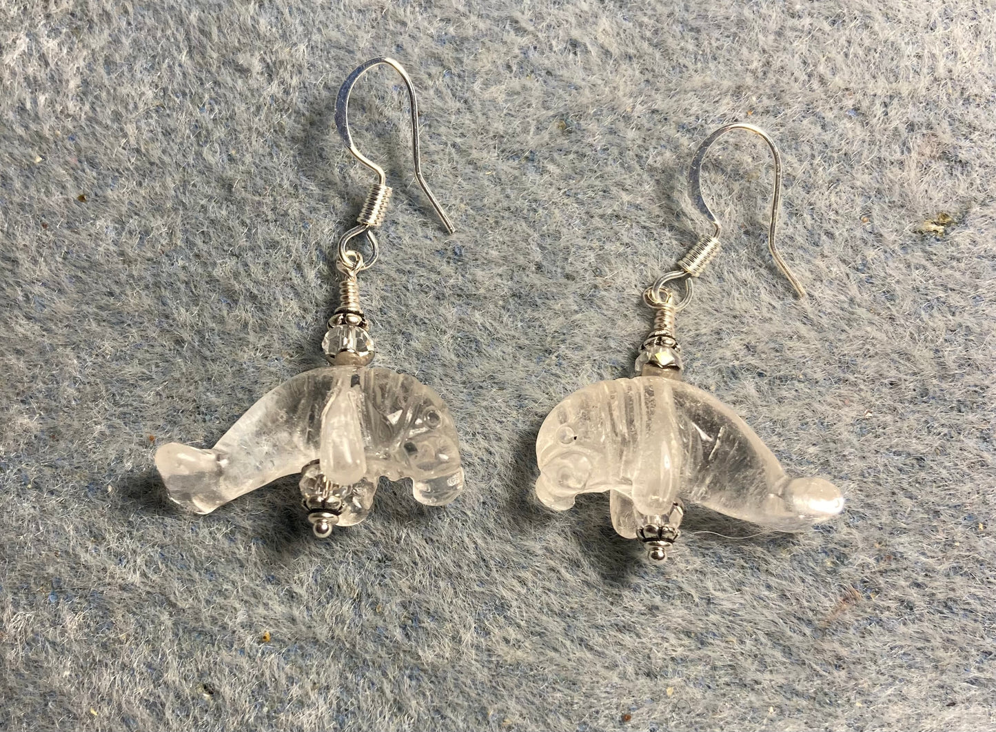 Clear rock crystal gemstone manatee bead earrings adorned with clear Chinese crystal beads.