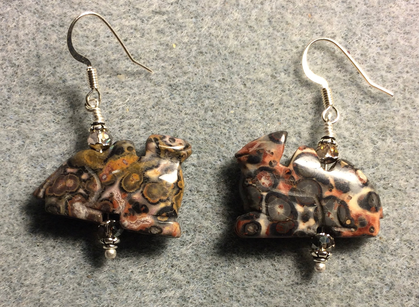 Pink leopard skin jasper gemstone camel bead earrings adorned with pink Chinese crystal beads.