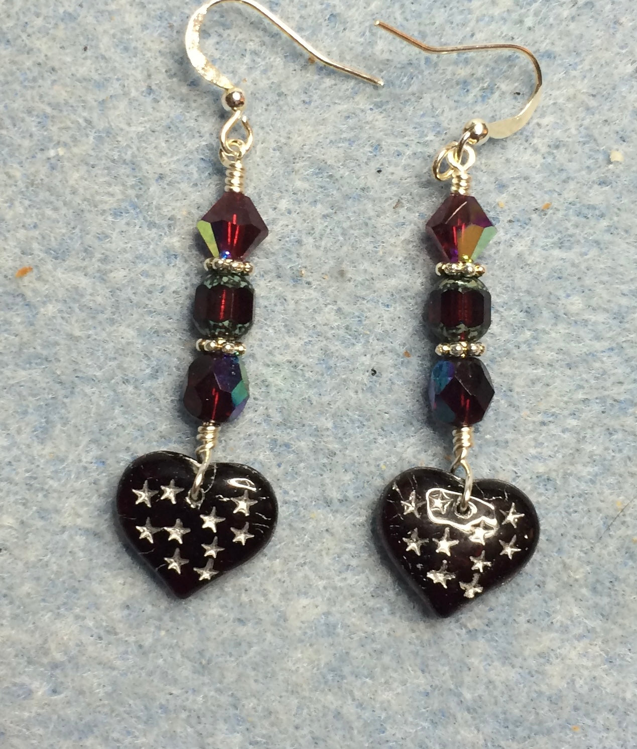 Dark red Czech glass heart bead earrings adorned with dark red Czech glass beads.