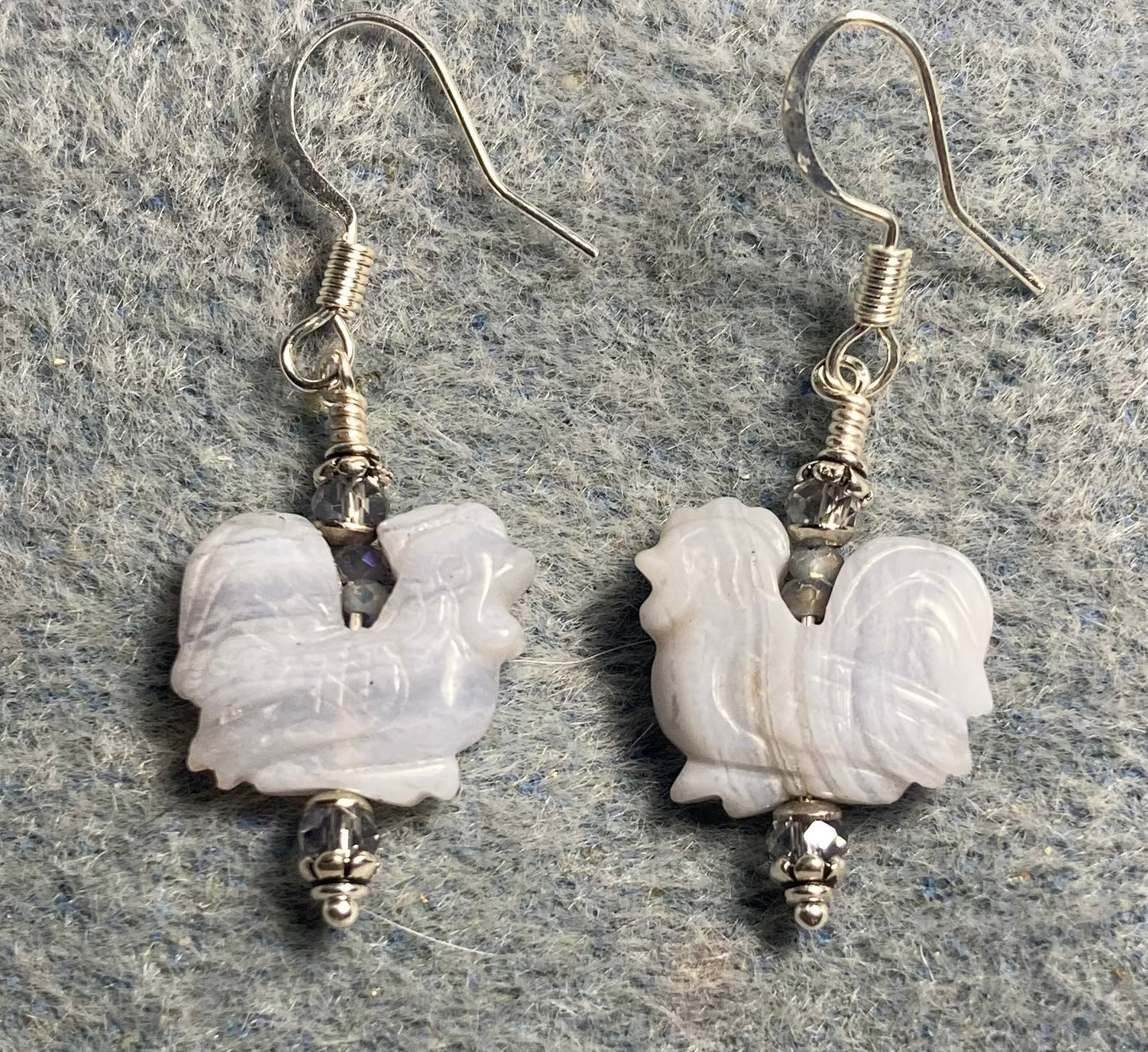 Gorgeous blue lace agate gemstone chicken bead earrings adorned with small light blue Chinese crystal beads.