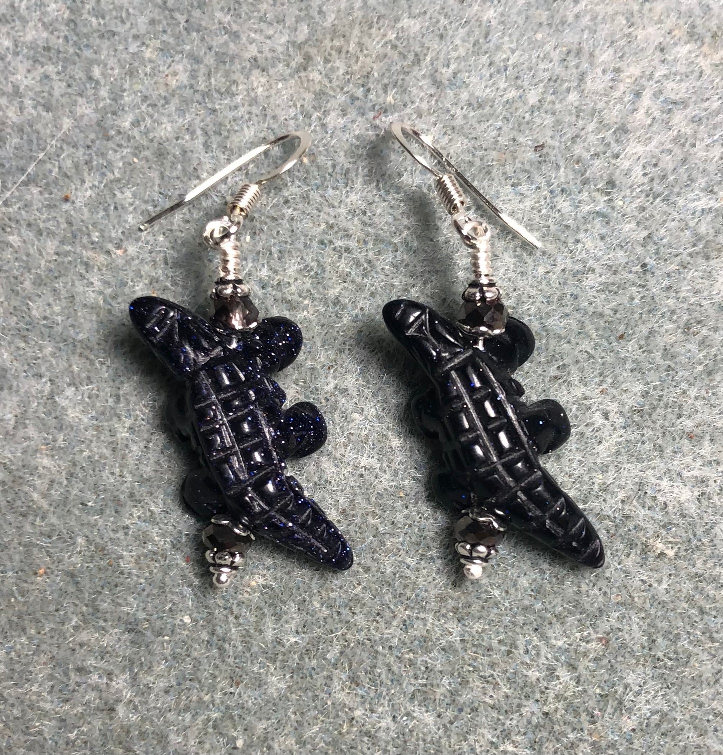 Blue goldstone gemstone alligator bead earrings adorned with purple Chinese crystal beads.