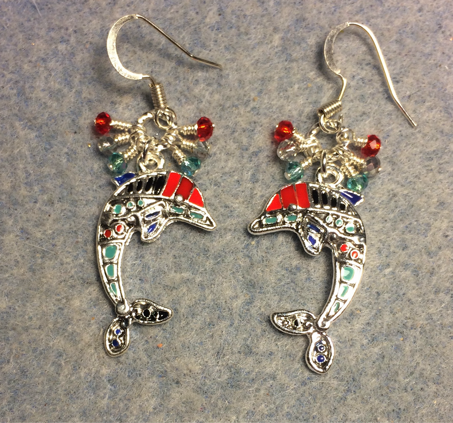Red, silver, and turquoise enamel dolphin charm earrings adorned with small dangling red, silver, and turquoise Chinese crystal beads.