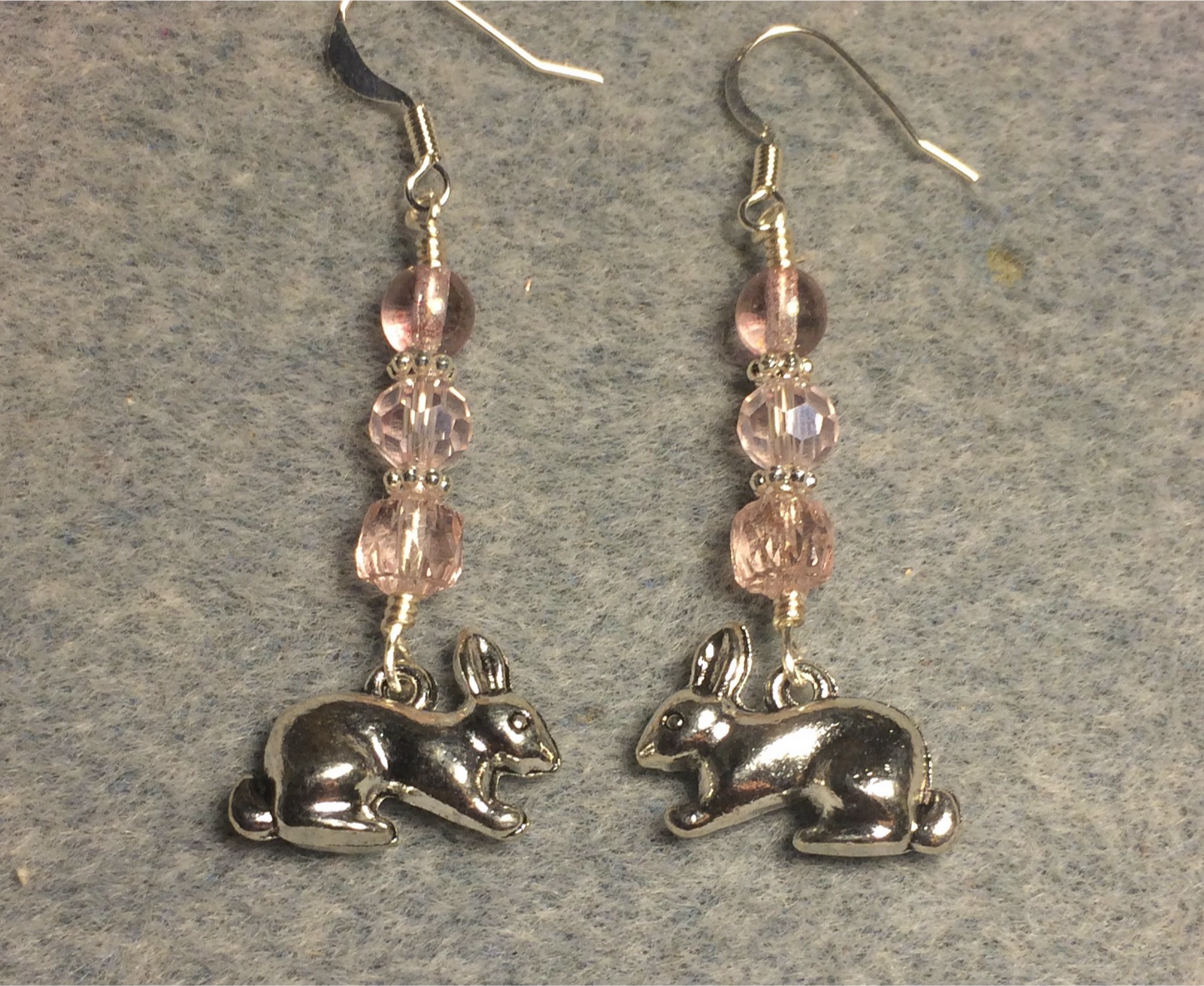 Silver rabbit charm earrings adorned with pink Czech glass beads
