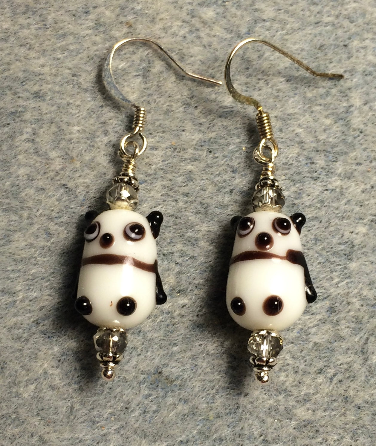 Small black and white lamp work panda bear bead earrings adorned with clear Chinese crystal beads.