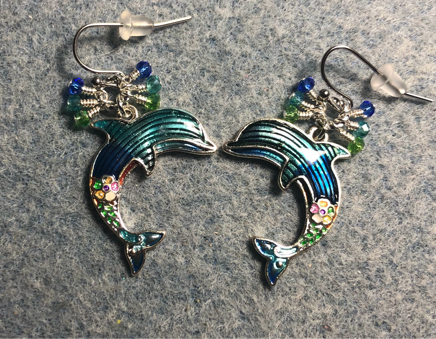 Turquoise, blue, and green enamel dolphin charm earrings adorned with tiny dangling turquoise, blue, and green Chinese crystal beads.