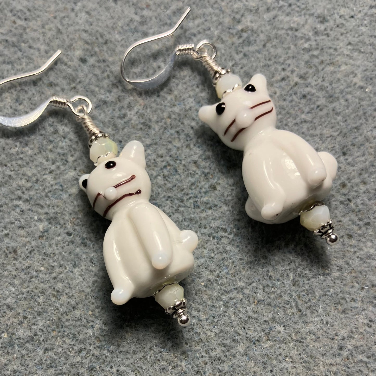 Opaque white lamp cat bead earrings adorned with white Chinese crystal beads.