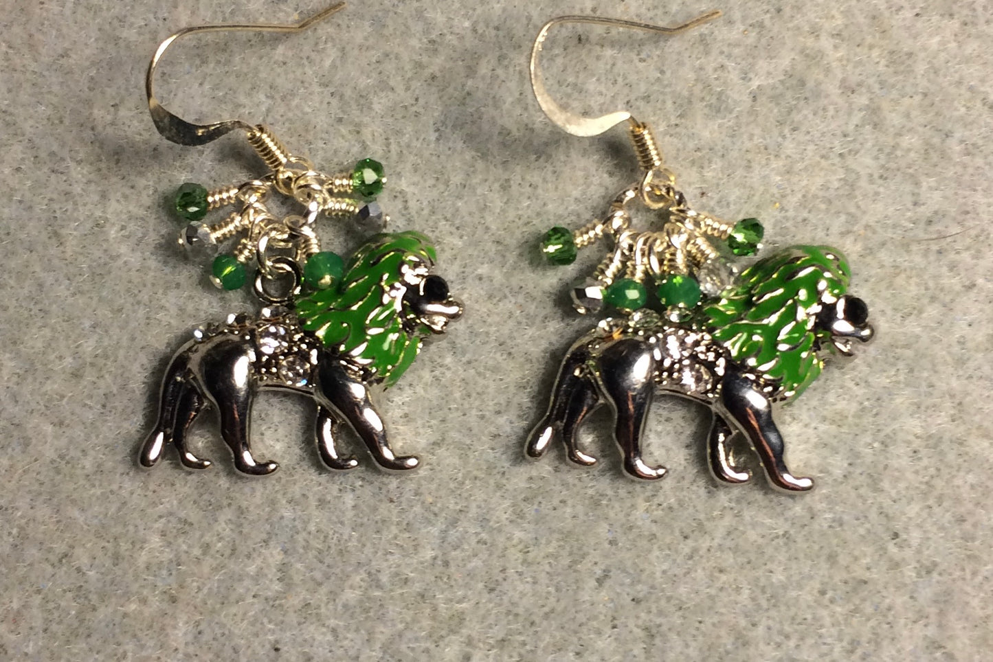Silver and green enamel and rhinestone lion charm earrings adorned with tiny dangling green and silver Chinese crystal beads.