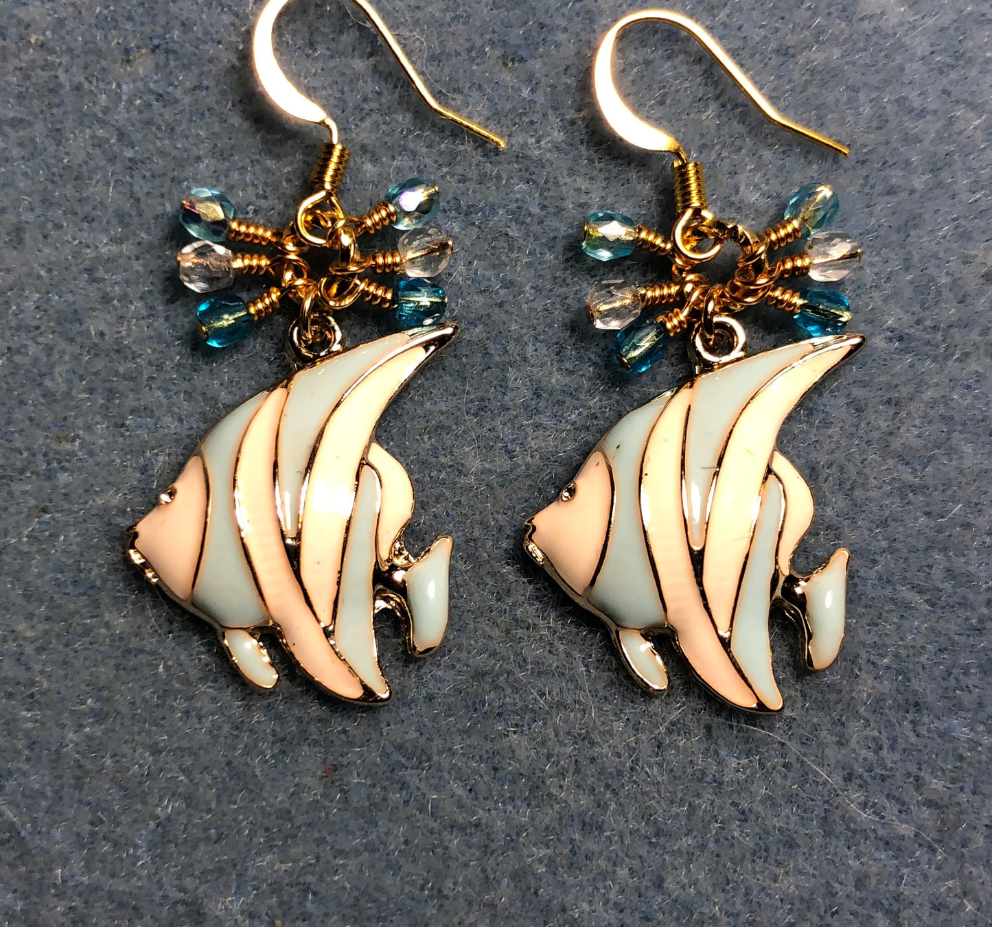 Aqua and white enamel striped angelfish charm earrings adorned with small dangling aqua and clear Czech glass beads.